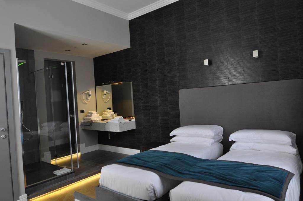 Place 24 Suites & Wellness روما الغرفة الصورة