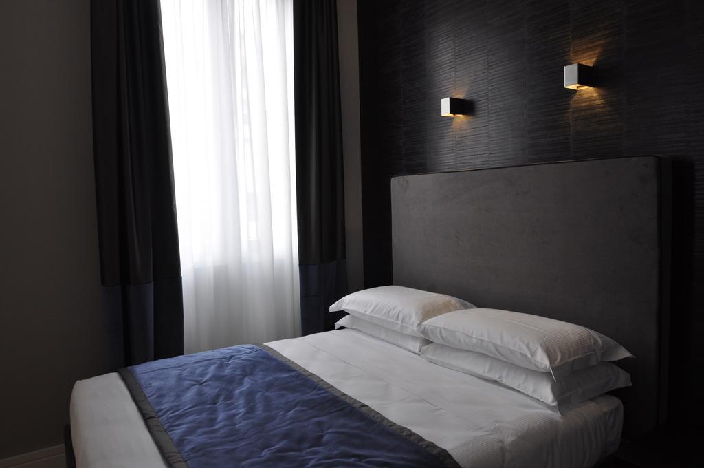 Place 24 Suites & Wellness روما الغرفة الصورة