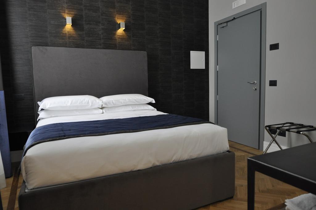Place 24 Suites & Wellness روما الغرفة الصورة