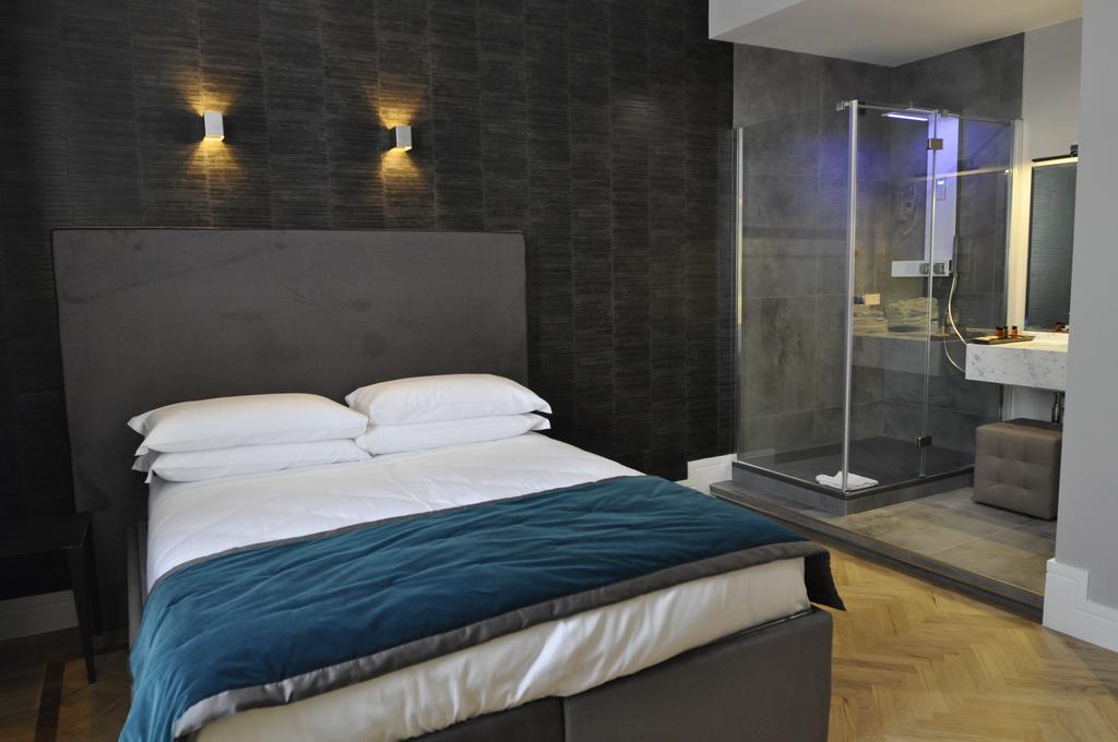 Place 24 Suites & Wellness روما الغرفة الصورة